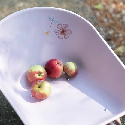 Apples in a white container with decorative stickers on a textured surface