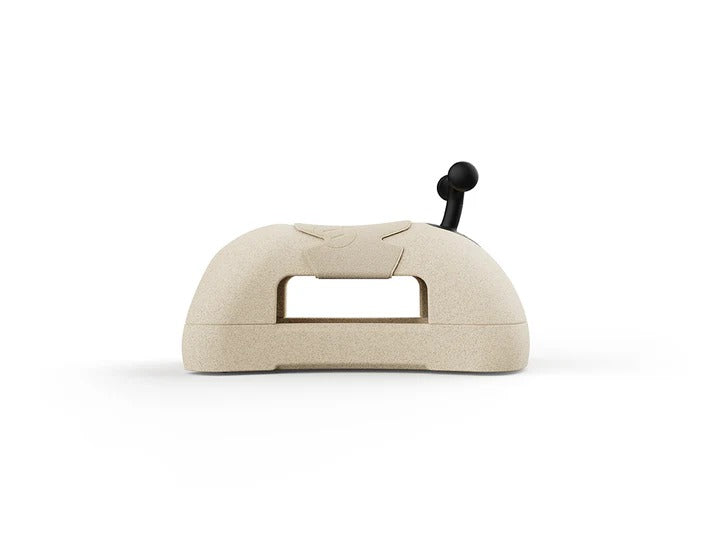 Beige fabric-covered object with a black handle on a white background