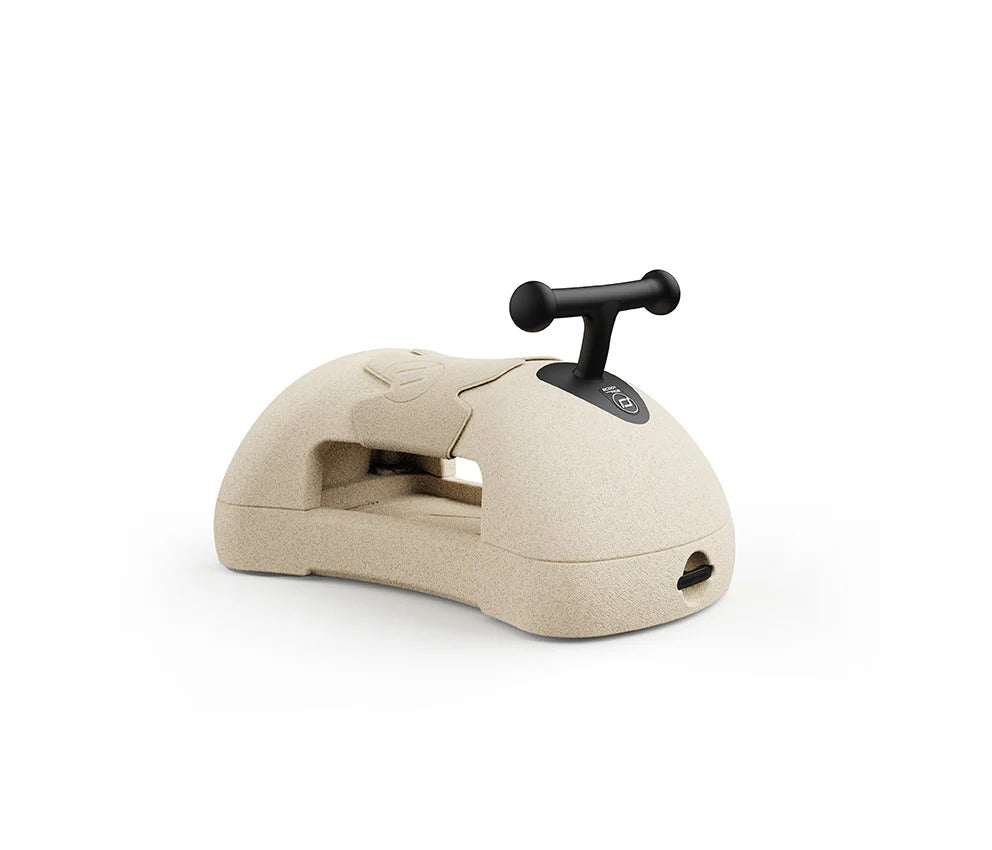 Beige office stapler with black handle on a white background