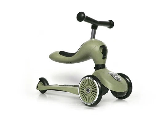 Children's balance bike with scooter attachment on a white background