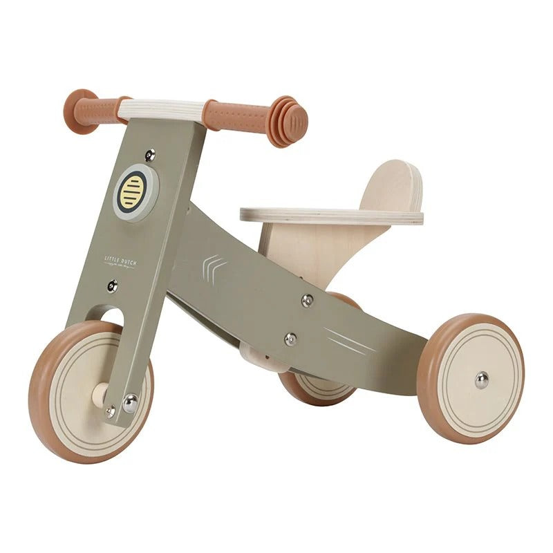 Children's balance bike with wooden handlebars and wheels on a white background