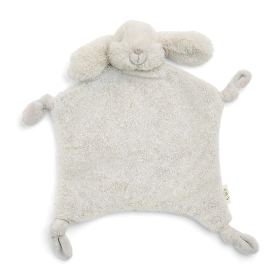 Fluffy white sheep-shaped comfort blanket on a white background