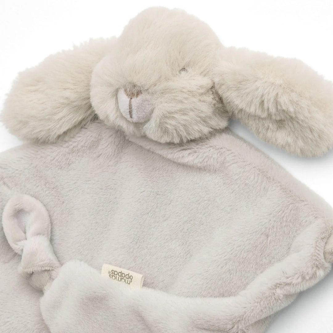 Plush bunny toy with a soft blanket on a white background