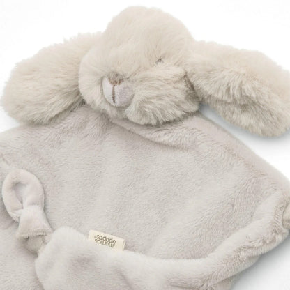 Plush bunny toy with a soft blanket on a white background