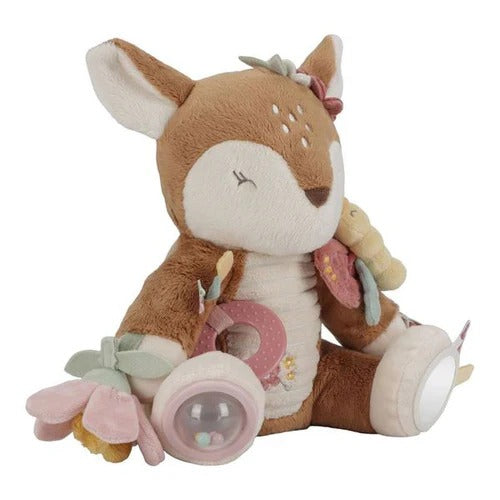 Plush deer toy with floral elements and a pacifier on a white background