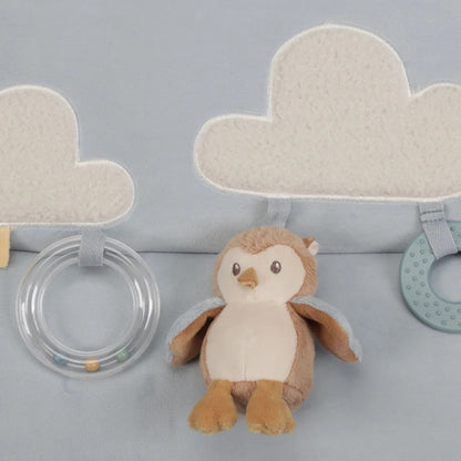 Plush owl toy with two cloud-shaped rattles on a gray background