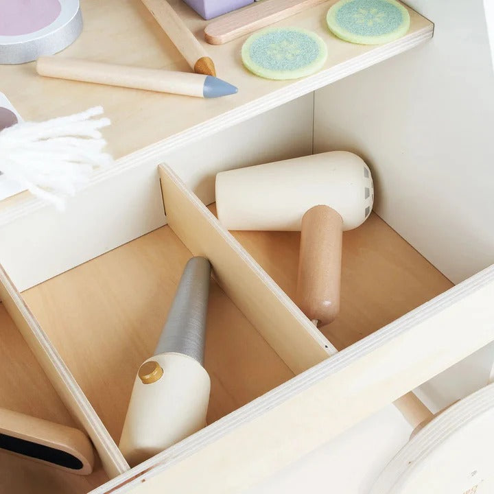 Roller brush set with gloves and sponges in a storage drawer