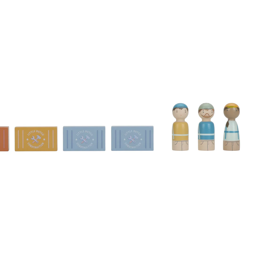 Set of wooden peg dolls and colorful blocks on a white background