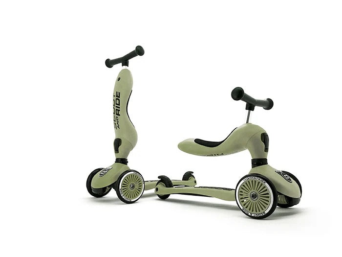 Two green children's scooters on a white background