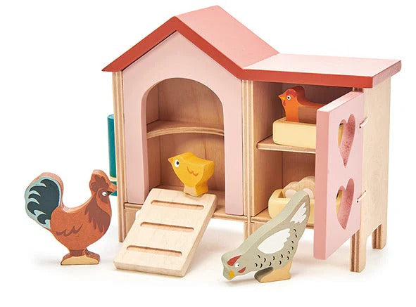 Wooden toy barn with animals on a white background