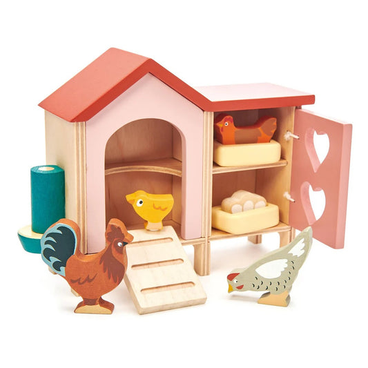 Wooden toy chicken coop with chickens and eggs on a white background