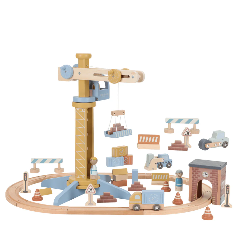 Wooden toy railway set with various pieces on a white background