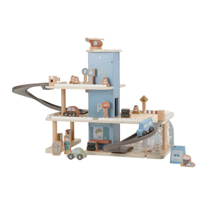 Wooden toy train set with tracks and buildings on a white background
